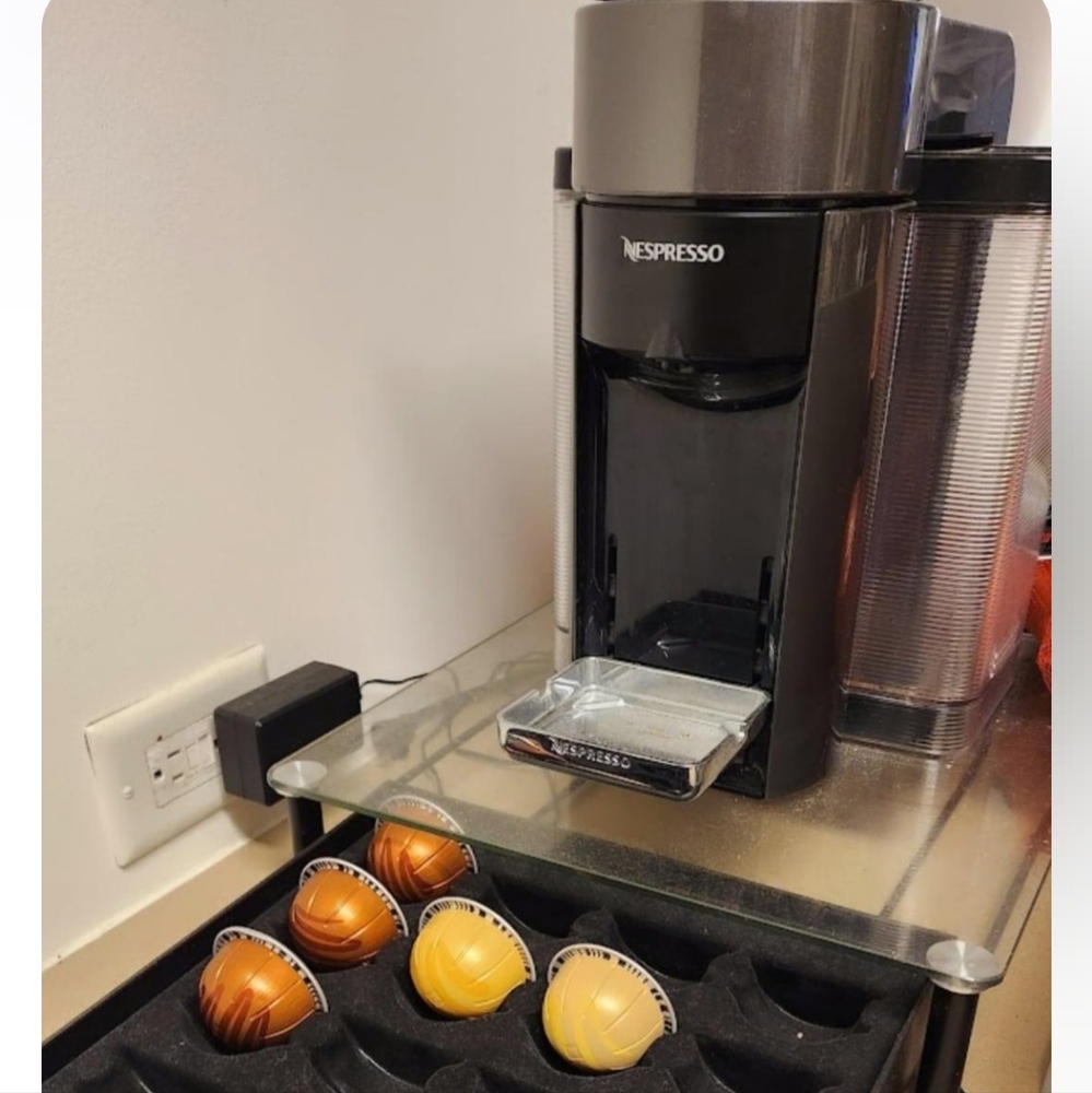 Nespresso Machine with Black and Silver Finish and Coffee Pods
